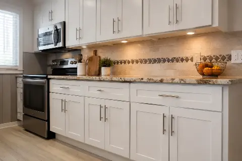 Refaced shaker cabinet doors in a warm white finish