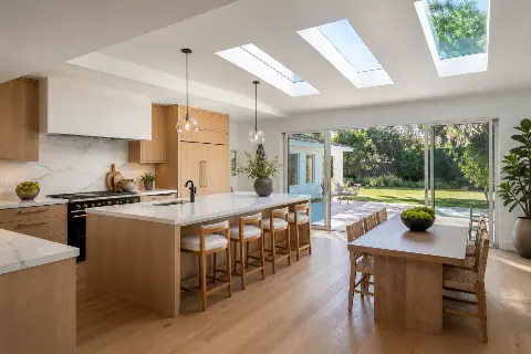 Kitchen extended into a rear addition with wide sliding glass doors